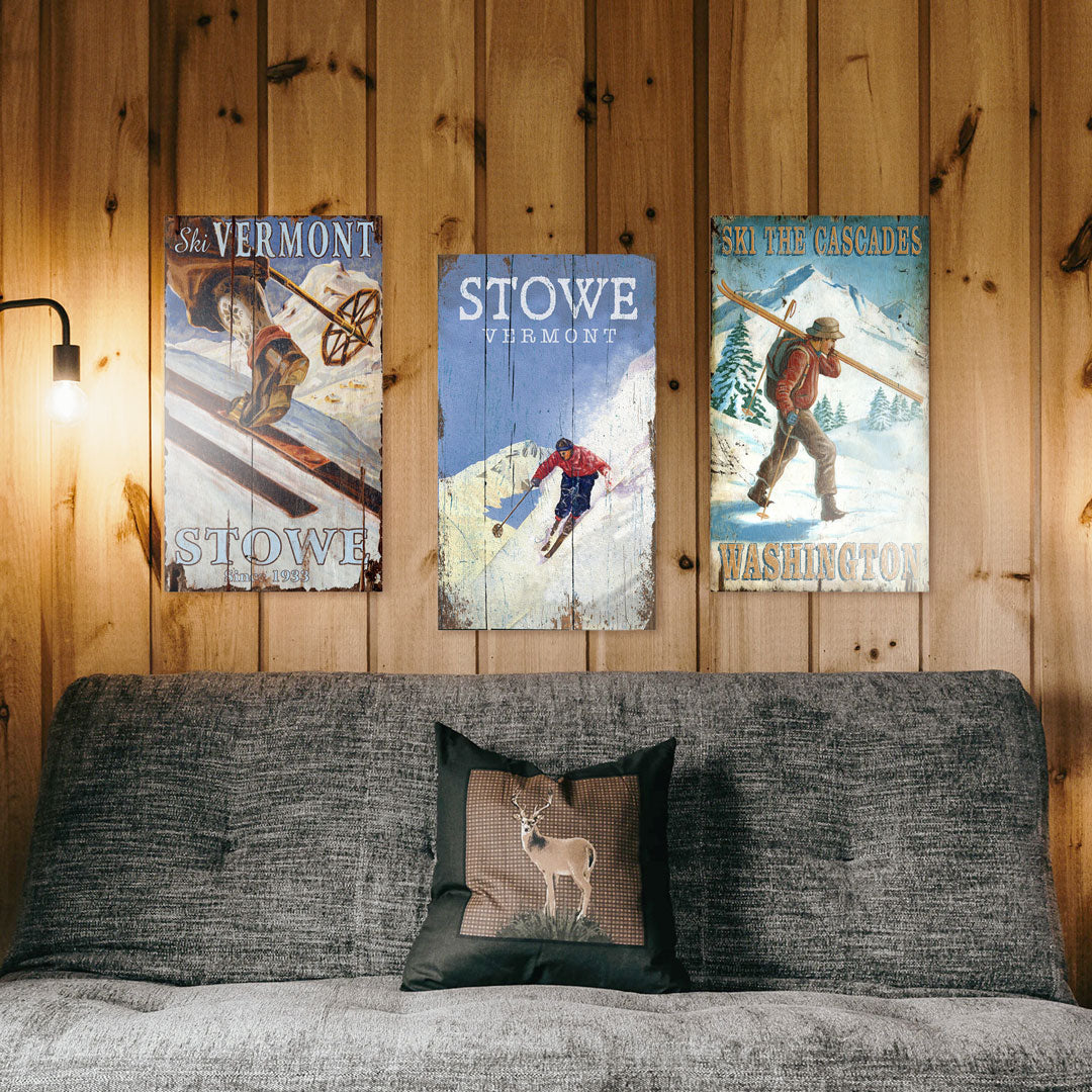 Ski and Snow themed wood signs in a rustic bedroom with wood wall paneling